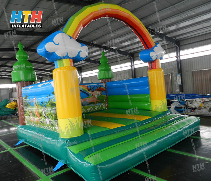 Rainbow Bounce House for indoor birthday party
