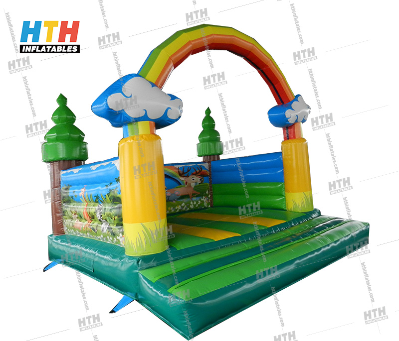 Rainbow Bounce House for indoor birthday party