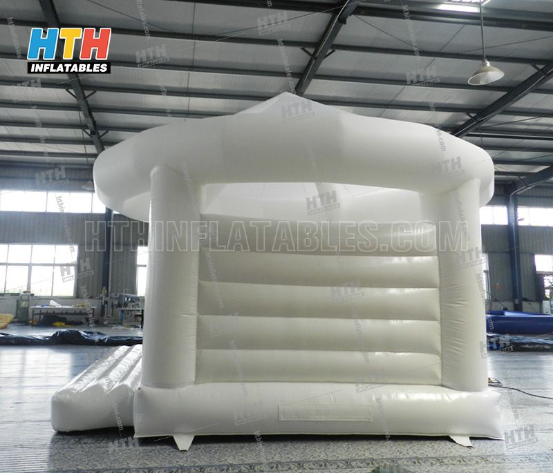 White bounce house for wedding party